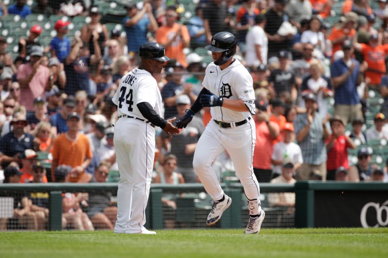 Jul 23, 2023; Detroit, Michigan, USA; Detroit Tigers infielder Spencer Torkelson (20) high fives first base coach Gary Jones (44) after hitting a home run during the first inning of the game against the San Diego Padres at Comerica Park. Mandatory Credit: Brian Bradshaw Sevald-USA TODAY Sports