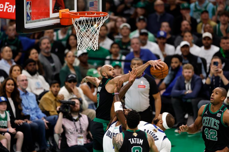 BOSTON, MA - JUNE 9: Derrick White #9 of the Boston Celtics blocks the ball during the game against the Dallas Mavericks during Game Two of the 2024 NBA Finals on June 9, 2024 at the TD Garden in Boston, Massachusetts. NOTE TO USER: User expressly acknowledges and agrees that, by downloading and or using this photograph, User is consenting to the terms and conditions of the Getty Images License Agreement. Mandatory Copyright Notice: Copyright 2024 NBAE  (Photo by Mercedes Oliver/NBAE via Getty Images)