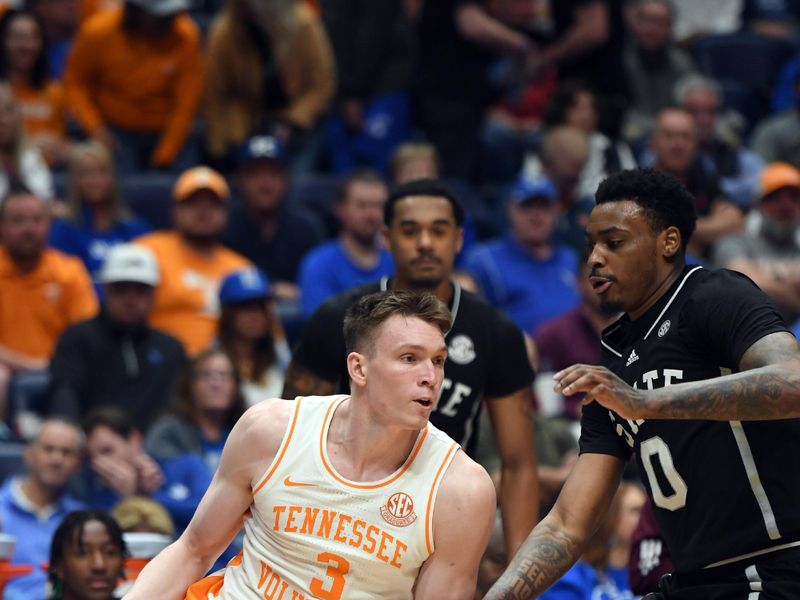 Mar 15, 2024; Nashville, TN, USA; Tennessee Volunteers guard Dalton Knecht (3) handles the ball against Mississippi State Bulldogs guard Dashawn Davis (10) during the first half at Bridgestone Arena. Mandatory Credit: Christopher Hanewinckel-USA TODAY Sports