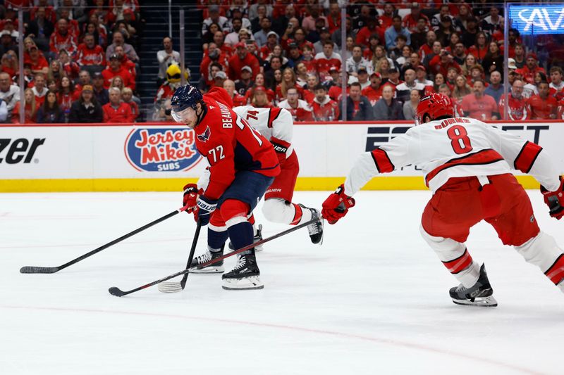 May 8, 2025; Washington, District of Columbia, USA; Washington Capitals left wing Anthony Beauvillier (72) skates with the puck as Carolina Hurricanes defenseman Jaccob Slavin (74) and Hurricanes defenseman Brent Burns (8) defend in the first period in game two of the second round of the 2025 Stanley Cup Playoffs at Capital One Arena. Mandatory Credit: Geoff Burke-Imagn Images