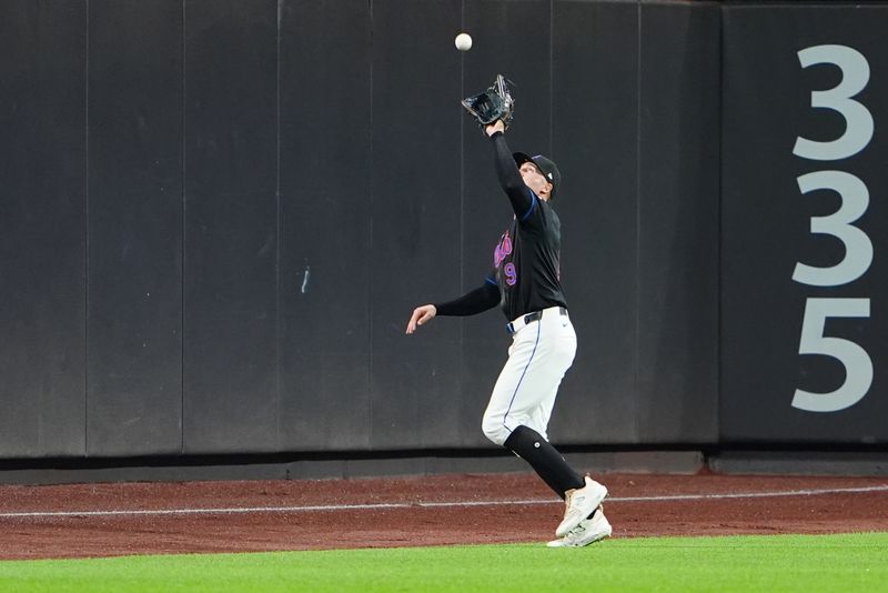 Jun 14, 2024; New York City, New York, USA;  New York Mets left fielder Brandon Nimmo (9) catches a fly ball hit by San Diego Padres center fielder Jackson Merrill (not pictured) during the seventh inning at Citi Field. Mandatory Credit: Gregory Fisher-USA TODAY Sports