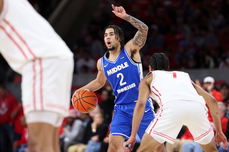 Dec 29, 2025; Houston, Texas, USA; Middle Tennessee Blue Raiders guard Jahvin Carter (2) controls the ball during the first half against the Houston Cougars at Fertitta Center. Mandatory Credit: Troy Taormina-Imagn Images