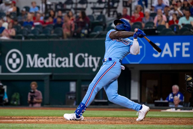 Sep 3, 2023; Arlington, Texas, USA; Texas Rangers right fielder Adolis Garcia (53) hits a walk off home run for the win over the Minnesota Twins during the ninth inning at Globe Life Field. Mandatory Credit: Jerome Miron-USA TODAY Sports