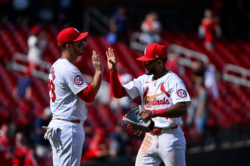 Aug 22, 2024; St. Louis, Missouri, USA;  St. Louis Cardinals center fielder Victor Scott II (11) celebrates with third baseman Nolan Arenado (28) after the Cardinals defeated the Milwaukee Brewers at Busch Stadium. Mandatory Credit: Jeff Curry-USA TODAY Sports