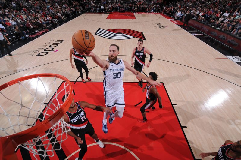 PORTLAND, OR - NOVEMBER 10: Jay Huff #30 of the Memphis Grizzlies shoots the ball during the game against the Portland Trail Blazers on November 10, 2024 at the Moda Center Arena in Portland, Oregon. NOTE TO USER: User expressly acknowledges and agrees that, by downloading and or using this photograph, user is consenting to the terms and conditions of the Getty Images License Agreement. Mandatory Copyright Notice: Copyright 2024 NBAE (Photo by Cameron Browne/NBAE via Getty Images)