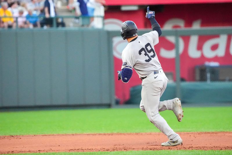 Jun 12, 2024; Kansas City, Missouri, USA; New York Yankees catcher Jose Trevino (39) celebrates toward fans while running the bases after hitting a three run home run against the Kansas City Royals in the first inning  at Kauffman Stadium. Mandatory Credit: Denny Medley-USA TODAY Sports