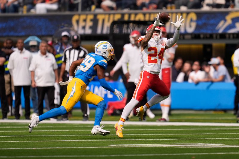 Kansas City Chiefs wide receiver Skyy Moore (24) misses a pass as Los Angeles Chargers cornerback Tarheeb Still (29) defends during the first half of an NFL football game Sunday, Sept. 29, 2024, in Inglewood, Calif. (AP Photo/Marcio Jose Sanchez)