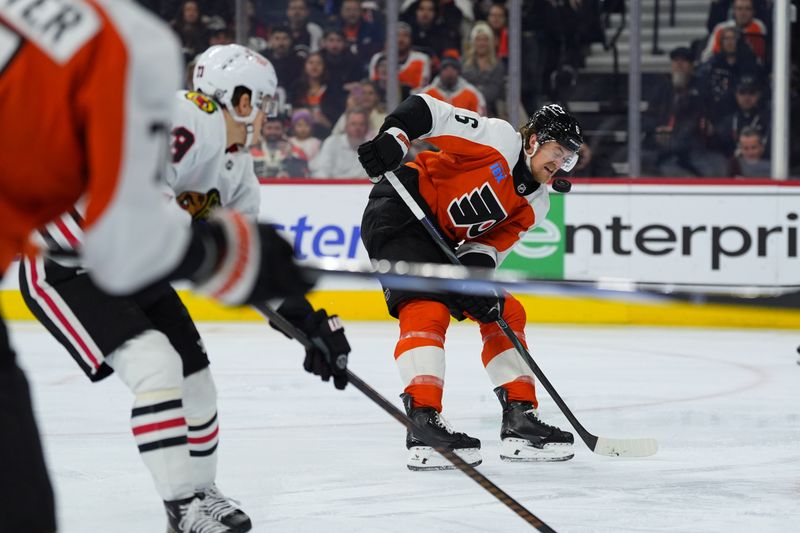 Nov 23, 2024; Philadelphia, Pennsylvania, USA; Philadelphia Flyers defenseman Travis Sanheim (6) is hit by a deflected pass against the Chicago Blackhawks in the first period at Wells Fargo Center. Mandatory Credit: Kyle Ross-Imagn Images