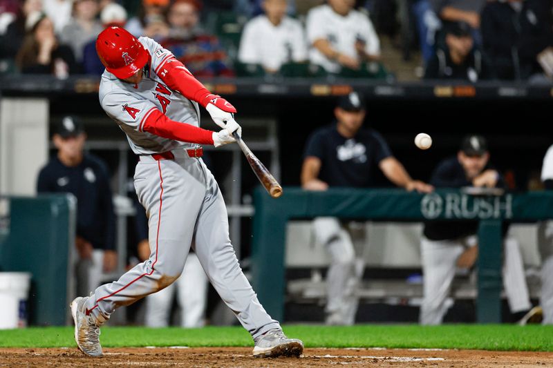 Sep 24, 2024; Chicago, Illinois, USA; Los Angeles Angels first baseman Eric Wagaman (34) hits an RBI-double against the Chicago White Sox during the seventh inning at Guaranteed Rate Field. Mandatory Credit: Kamil Krzaczynski-Imagn Images