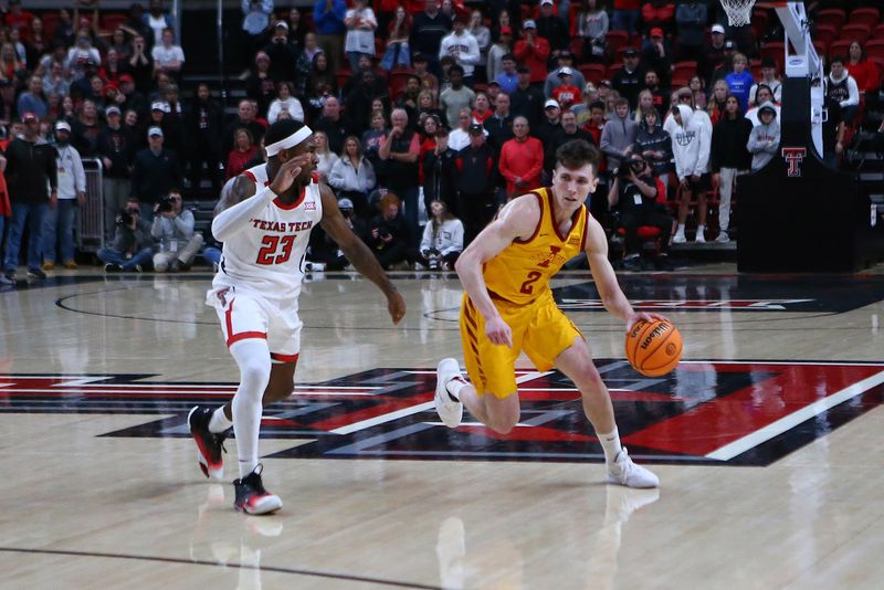 Jan 30, 2023; Lubbock, Texas, USA;  Iowa State Cyclones guard Caleb Grill (2) dribbles the ball against Texas Tech Red Raiders guard De   Vion Harmon (23) in overtime at United Supermarkets Arena. Mandatory Credit: Michael C. Johnson-USA TODAY Sports