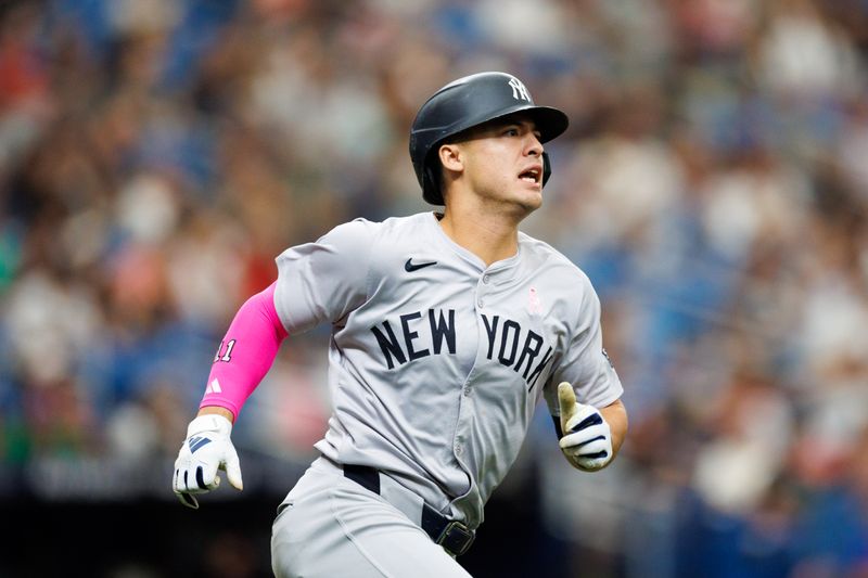 May 12, 2024; St. Petersburg, Florida, USA;  New York Yankees shortstop Anthony Volpe (11) runs the bases after hitting a triple against the Tampa Bay Rays in the first inning at Tropicana Field. Mandatory Credit: Nathan Ray Seebeck-USA TODAY Sports