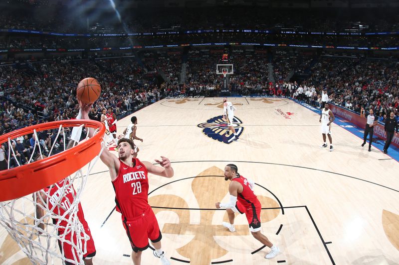 NEW ORLEANS, LA - FEBRUARY 22: Alperen Sengun #28 of the Houston Rockets grabs a rebound during the game against the New Orleans Pelicans on February 22, 2024 at the Smoothie King Center in New Orleans, Louisiana. NOTE TO USER: User expressly acknowledges and agrees that, by downloading and or using this Photograph, user is consenting to the terms and conditions of the Getty Images License Agreement. Mandatory Copyright Notice: Copyright 2024 NBAE (Photo by Layne Murdoch Jr./NBAE via Getty Images)