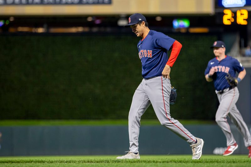 May 3, 2024; Minneapolis, Minnesota, USA; Boston Red Sox pitcher Naoyuki Uwasawa (39) walks off the field after ending the seventh inning against the Minnesota Twins at Target Field. Mandatory Credit: Jesse Johnson-USA TODAY Sports