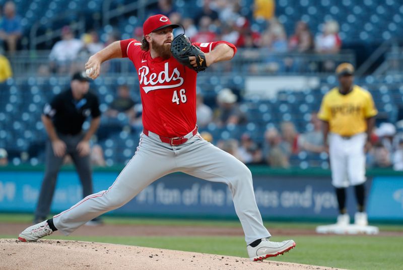 Aug 23, 2024; Pittsburgh, Pennsylvania, USA;  Cincinnati Reds starting pitcher Buck Farmer (46) delivers a pitch against the Pittsburgh Pirates during the first inning at PNC Park. Mandatory Credit: Charles LeClaire-USA TODAY Sports