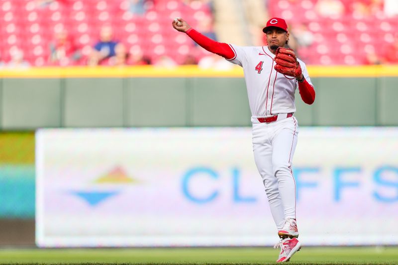 Apr 22, 2024; Cincinnati, Ohio, USA; Cincinnati Reds second baseman Santiago Espinal (4) throws to first to get Philadelphia Phillies outfielder Brandon Marsh (not pictured) out in the second inning at Great American Ball Park. Mandatory Credit: Katie Stratman-USA TODAY Sports