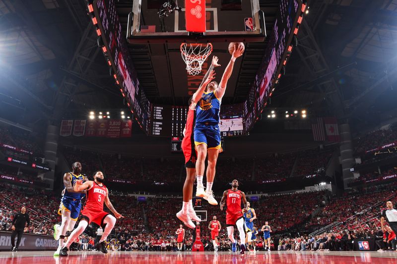 HOUSTON, TX - APRIL 23: Pat Spencer #61 of the Golden State Warriors drives to the basket during the game against the Houston Rockets during Round 1 Game 2 of the 2025 NBA Playoffs on April 23, 2025 at the Toyota Center in Houston, Texas. NOTE TO USER: User expressly acknowledges and agrees that, by downloading and or using this photograph, User is consenting to the terms and conditions of the Getty Images License Agreement. Mandatory Copyright Notice: Copyright 2025 NBAE (Photo by Noah Graham/NBAE via Getty Images)