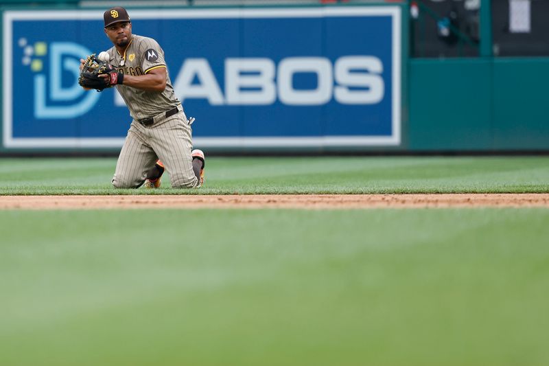 Jul 25, 2024; Washington, District of Columbia, USA; San Diego Padres second baseman Xander Bogaerts (2) bobbles the ball while making a play to first base on a ground ball by Washington Nationals catcher Keibert Ruiz (not pictured) during the eighth inning at Nationals Park. Mandatory Credit: Geoff Burke-USA TODAY Sports