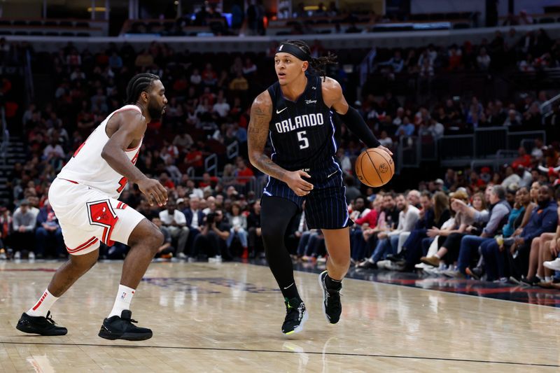 CHICAGO, IL - OCTOBER 30: Paolo Banchero #5 of the Orlando Magic dribbles the ball during the game against the Chicago Bulls on October 30, 2024 at United Center in Chicago, Illinois. NOTE TO USER: User expressly acknowledges and agrees that, by downloading and or using this photograph, User is consenting to the terms and conditions of the Getty Images License Agreement. Mandatory Copyright Notice: Copyright 2024 NBAE (Photo by Kamil Krzaczynski/NBAE via Getty Images)