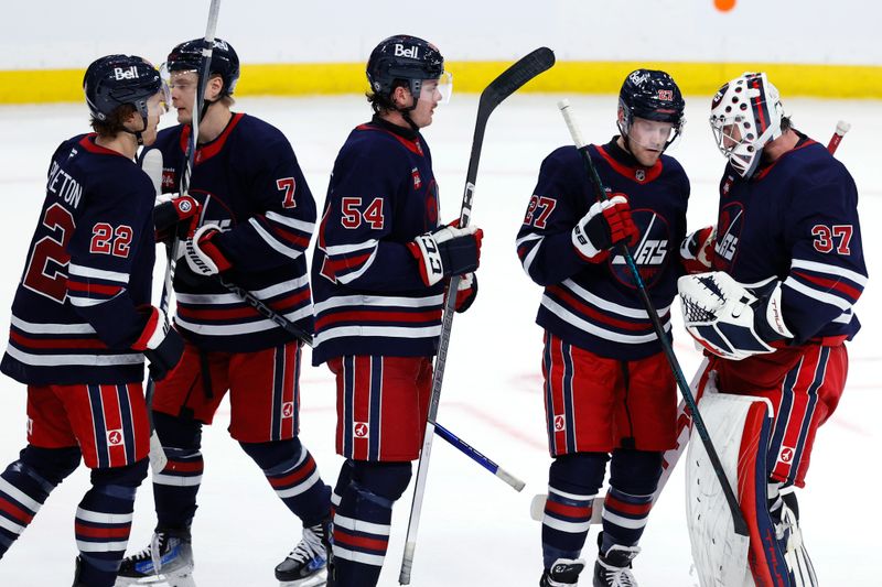 Nov 9, 2024; Winnipeg, Manitoba, CAN; Winnipeg Jets celebrate their victory over the Dallas Stars at Canada Life Centre. Mandatory Credit: James Carey Lauder-Imagn Images
