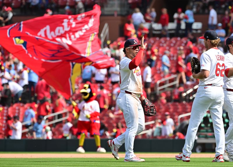 Apr 13, 2025; St. Louis, Missouri, USA; St. Louis Cardinals first baseman Willson Contreras (40, left) and other Cardinals players line up to congratulate St. Louis Cardinals pitcher Kyle Leahy (62) after the Cardinals defeated the Philadelphia Phillies at Busch Stadium. Mandatory Credit: Tim Vizer-Imagn Images