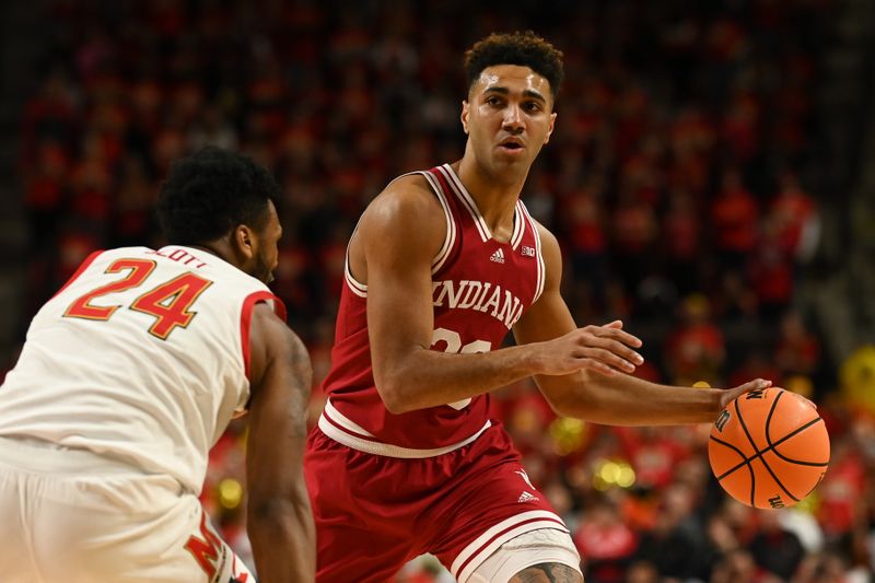 Jan 31, 2023; College Park, Maryland, USA;  Indiana Hoosiers forward Trayce Jackson-Davis (23) dribbles ass Maryland Terrapins forward Donta Scott (24) defends during the first half at Xfinity Center. Mandatory Credit: Tommy Gilligan-USA TODAY Sports