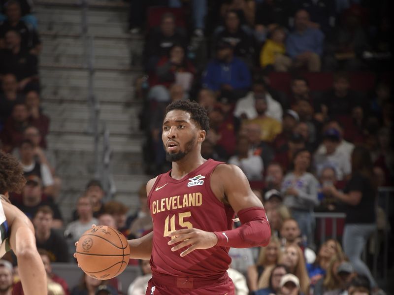 CLEVELAND, OH - NOVEMBER 4: Donovan Mitchell #45 of the Cleveland Cavaliers dribbles the ball during the game against the Milwaukee Bucks on November 4, 2024 at Rocket Mortgage FieldHouse in Cleveland, Ohio. NOTE TO USER: User expressly acknowledges and agrees that, by downloading and/or using this Photograph, user is consenting to the terms and conditions of the Getty Images License Agreement. Mandatory Copyright Notice: Copyright 2024 NBAE (Photo by David Liam Kyle/NBAE via Getty Images)