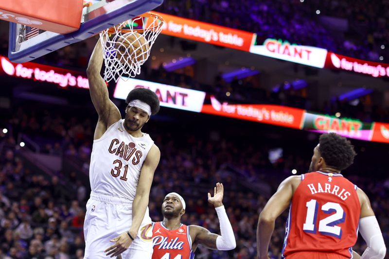 PHILADELPHIA, PENNSYLVANIA - FEBRUARY 23: Jarrett Allen #31 of the Cleveland Cavaliers dunks past Paul Reed #44 of the Philadelphia 76ers during the fourth quarter  at the Wells Fargo Center on February 23, 2024 in Philadelphia, Pennsylvania. (Photo by Tim Nwachukwu/Getty Images)