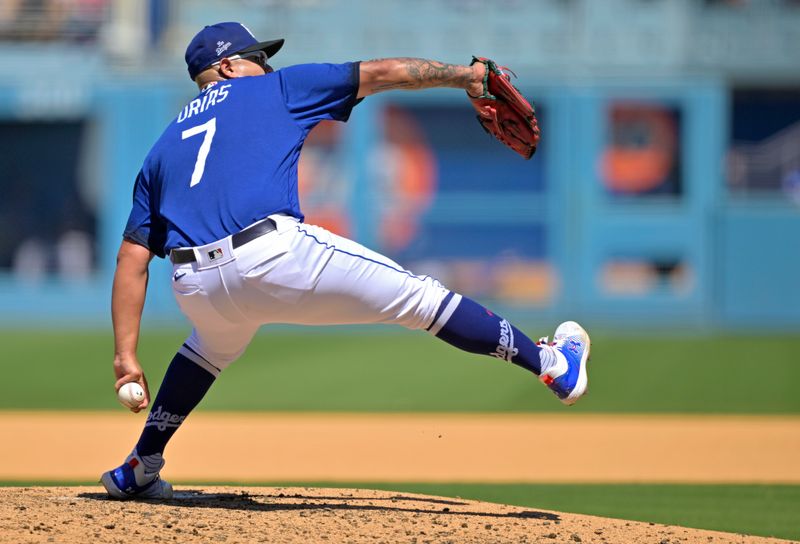 Aug 13, 2023; Los Angeles, California, USA; Los Angeles Dodgers starting pitcher Julio Urias (7) throws to the plate in the fifth inning against the Colorado Rockies at Dodger Stadium. Mandatory Credit: Jayne Kamin-Oncea-USA TODAY Sports