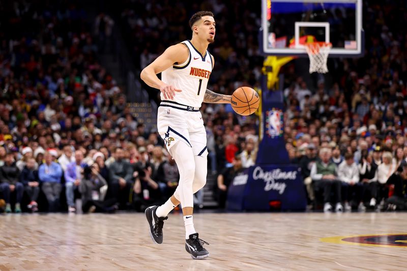 DENVER, COLORADO - DECEMBER 25: Michael Porter Jr. #1 of the Denver Nuggets dribbles up court against the Golden State Warriors in the first half at Ball Arena on December 25, 2023 in Denver, Colorado. NOTE TO USER: User expressly acknowledges and agrees that, by downloading and/or using this Photograph, user is consenting to the terms and conditions of the Getty Images License Agreement. (Photo by Jamie Schwaberow/Getty Images)