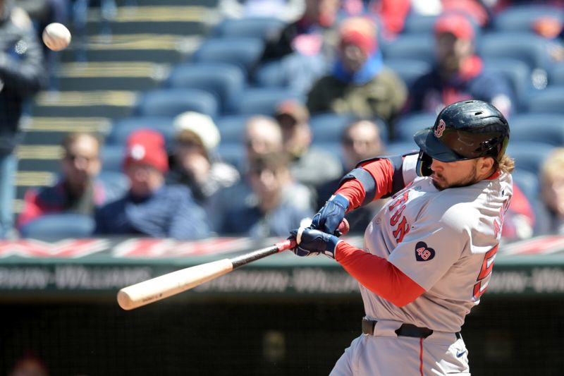 Apr 25, 2024; Cleveland, Ohio, USA; Boston Red Sox right fielder Wilyer Abreu (52) hits a sacrifice fly during the third inning against the Cleveland Guardians at Progressive Field. Mandatory Credit: Ken Blaze-USA TODAY Sports