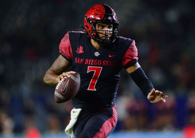 Sep 18, 2021; Carson, California, USA; San Diego State Aztecs quarterback Lucas Johnson (7) moves out to pass against the Utah Utes during overtime at Dignity Health Sports Park. Mandatory Credit: Gary A. Vasquez-USA TODAY Sports