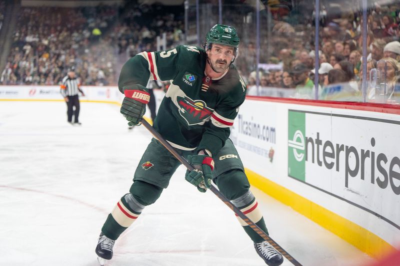 Nov 14, 2024; Saint Paul, Minnesota, USA; Minnesota Wild defenseman Jake Middleton (5) on the forecheck against the Montreal Canadiens in the second period at Xcel Energy Center. Mandatory Credit: Matt Blewett-Imagn Images