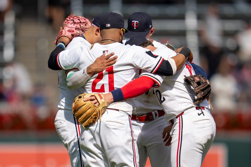 Sep 15, 2024; Minneapolis, Minnesota, USA; Minnesota Twins players huddle on the field after defeating the Cincinnati Reds at Target Field. Mandatory Credit: Jesse Johnson-Imagn Images