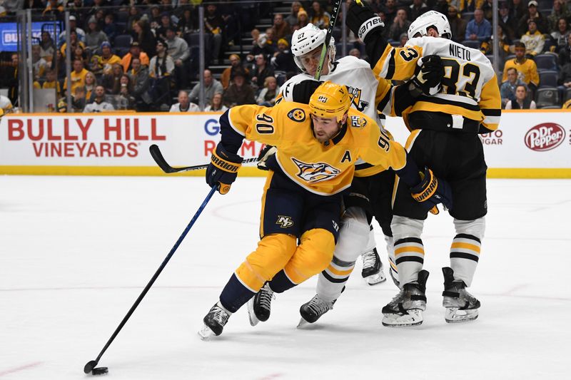 Nov 28, 2023; Nashville, Tennessee, USA; Nashville Predators center Ryan O'Reilly (90) handles the puck against Pittsburgh Penguins defenseman Ryan Graves (27) and left wing Matt Nieto (83) during the first period at Bridgestone Arena. Mandatory Credit: Christopher Hanewinckel-USA TODAY Sports