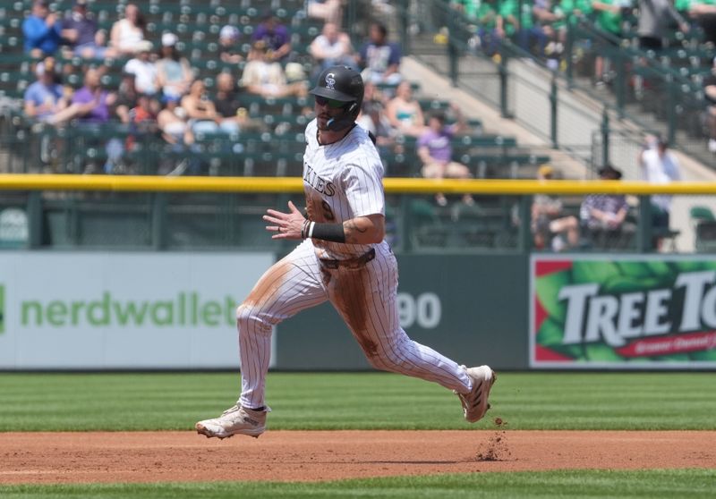 Apr 25, 2024; Denver, Colorado, USA; Colorado Rockies outfielder Brenton Doyle (9) runs the bases in the first inning against the San Diego Padres at Coors Field. Mandatory Credit: Ron Chenoy-USA TODAY Sports