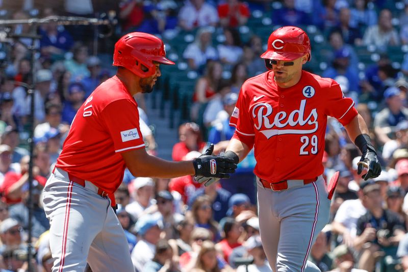 Jun 2, 2024; Chicago, Illinois, USA; 
Cincinnati Reds outfielder TJ Friedl (29) celebrates with third baseman Jeimer Candelario (3) after hitting a three-run home run against the Chicago Cubs during the second inning at Wrigley Field. Mandatory Credit: Kamil Krzaczynski-USA TODAY Sports