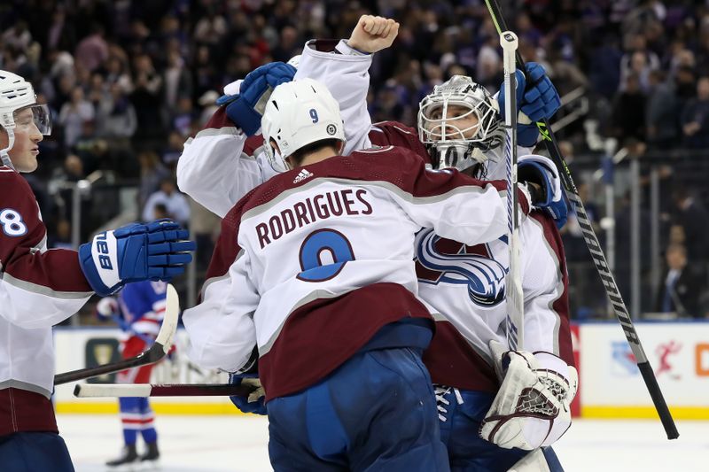 Oct 25, 2022; New York, New York, USA; Colorado Avalanche goaltender Alexandar Georgiev (40) celebrates with Colorado Avalanche center Evan Rodrigues (9) and Colorado Avalanche defenseman Cale Makar (8) after defeating New York Rangers in a shootout at Madison Square Garden. Mandatory Credit: Tom Horak-USA TODAY Sports