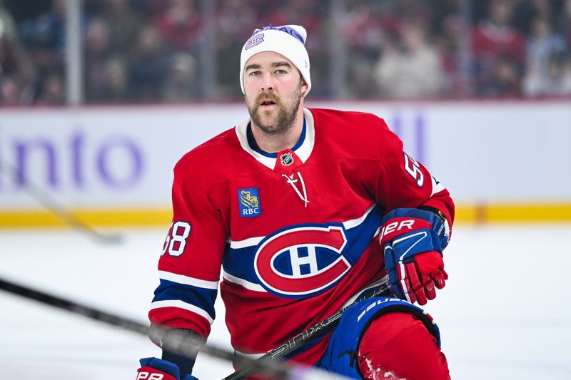 Nov 23, 2024; Montreal, Quebec, CAN; Montreal Canadiens defenseman David Savard (58) looks on wearing a Hockey fights cancer tuque during warm-up before the game against the Las Vegas Golden Knights at Bell Centre. Mandatory Credit: David Kirouac-Imagn Images