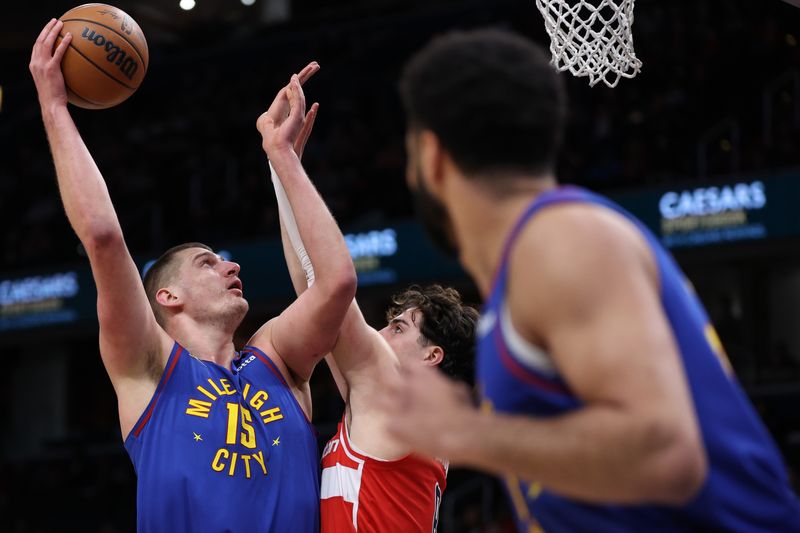 WASHINGTON, DC - JANUARY 21: Nikola Jokic #15 of the Denver Nuggets shoots against the Washington Wizards at Capital One Arena on January 21, 2024 in Washington, DC. NOTE TO USER: User expressly acknowledges and agrees that, by downloading and or using this photograph, User is consenting to the terms and conditions of the Getty Images License Agreement. (Photo by Patrick Smith/Getty Images)