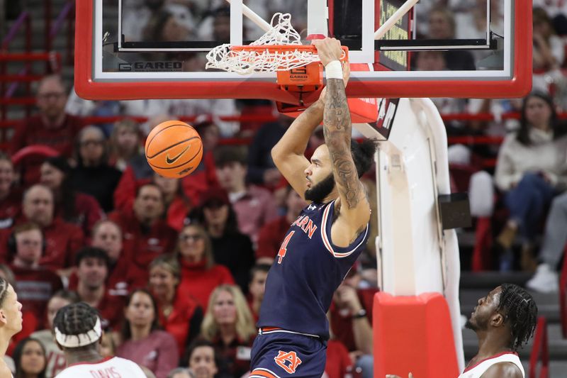 Jan 6, 2024; Fayetteville, Arkansas, USA; Auburn Tigers forward Johni Broome (4) dunks the ball in the second half against the Arkansas Razorbacks at Bud Walton Arena. Mandatory Credit: Nelson Chenault-USA TODAY Sports