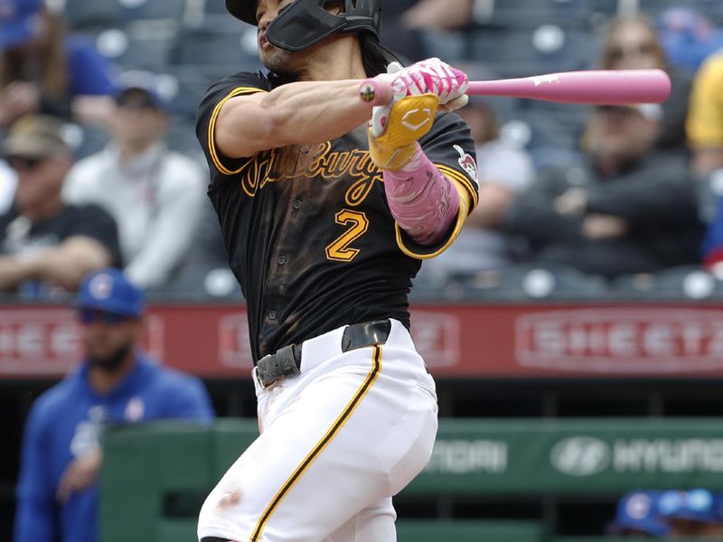 May 12, 2024; Pittsburgh, Pennsylvania, USA;  Pittsburgh Pirates right fielder Connor Joe (2) hits a double against the Chicago Cubs during the sixth inning at PNC Park. Mandatory Credit: Charles LeClaire-USA TODAY Sports