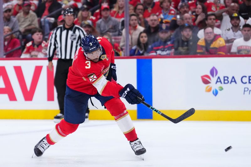 Apr 28, 2025; Sunrise, Florida, USA; Florida Panthers defenseman Seth Jones (3) shoots the puck against the Tampa Bay Lightning during the third period in game four of the first round of the 2025 Stanley Cup Playoffs at Amerant Bank Arena. Mandatory Credit: Rich Storry-Imagn Images