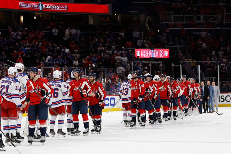 Apr 28, 2024; Washington, District of Columbia, USA; New York Rangers and Washington Capitals players shake hands in the handshake line after game four of the first round of the 2024 Stanley Cup Playoffs at Capital One Arena. Mandatory Credit: Geoff Burke-USA TODAY Sports