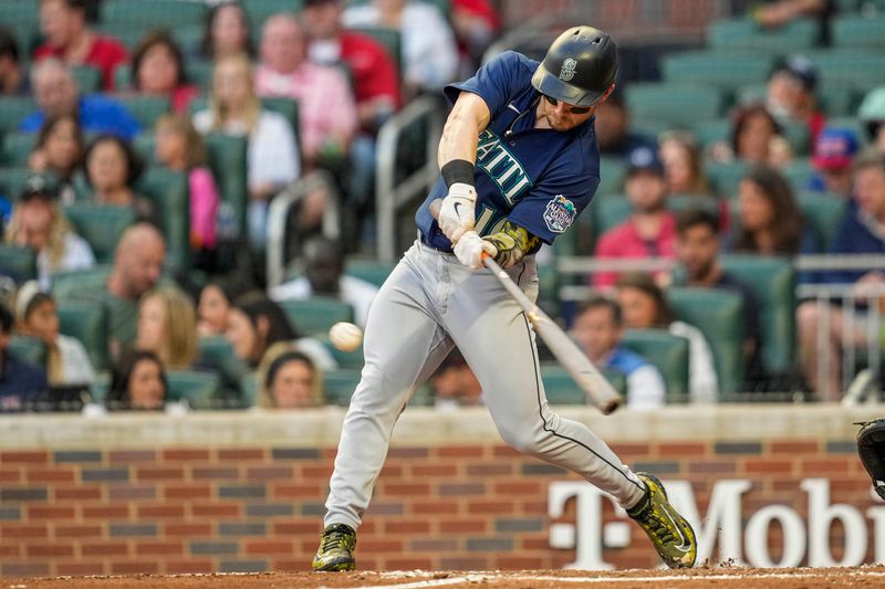 May 19, 2023; Cumberland, Georgia, USA; Seattle Mariners left fielder Jarred Kelenic (10) singles against the Atlanta Braves during the fourth inning at Truist Park. Mandatory Credit: Dale Zanine-USA TODAY Sports