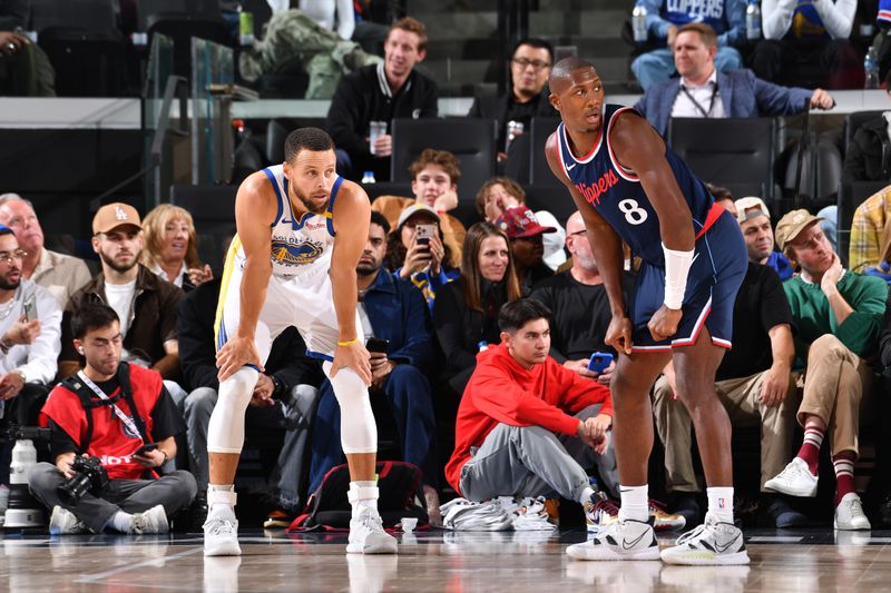 INGLEWOOD, CA - NOVEMBER 18: Stephen Curry #30 of the Golden State Warriors and Kris Dunn #8 of the LA Clippers look on during the game on November 18, 2024 at Intuit Dome in Los Angeles, California. NOTE TO USER: User expressly acknowledges and agrees that, by downloading and/or using this Photograph, user is consenting to the terms and conditions of the Getty Images License Agreement. Mandatory Copyright Notice: Copyright 2024 NBAE (Photo by Juan Ocampo/NBAE via Getty Images)