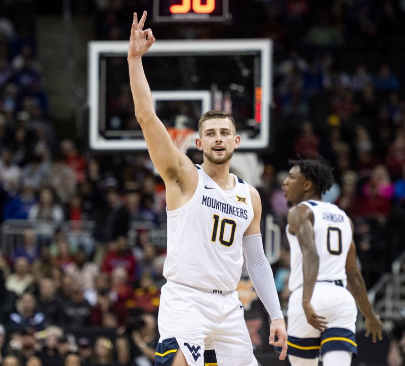 Mar 8, 2023; Kansas City, MO, USA; West Virginia Mountaineers guard Erik Stevenson (10) reacts against the Texas Tech Red Raiders in the second half at T-Mobile Center. Mandatory Credit: Amy Kontras-USA TODAY Sports