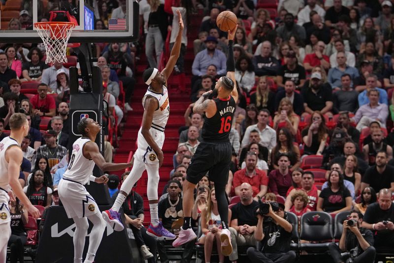 MIAMI, FL - MARCH 13: Caleb Martin #16 of the Miami Heat shoots the ball during the game against the Denver Nuggets on March 13, 2024 at Kaseya Center in Miami, Florida. NOTE TO USER: User expressly acknowledges and agrees that, by downloading and or using this Photograph, user is consenting to the terms and conditions of the Getty Images License Agreement. Mandatory Copyright Notice: Copyright 2024 NBAE (Photo by Eric Espada/NBAE via Getty Images)