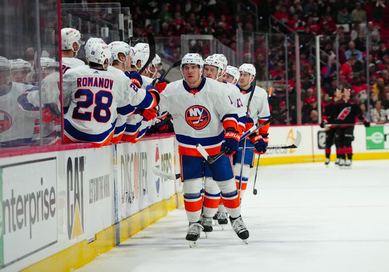 Apr 22, 2024; Raleigh, North Carolina, USA; New York Islanders center Bo Horvat (14) celebrates his goal against the Carolina Hurricanes during the first period in game two of the first round of the 2024 Stanley Cup Playoffs at PNC Arena. Mandatory Credit: James Guillory-USA TODAY Sports