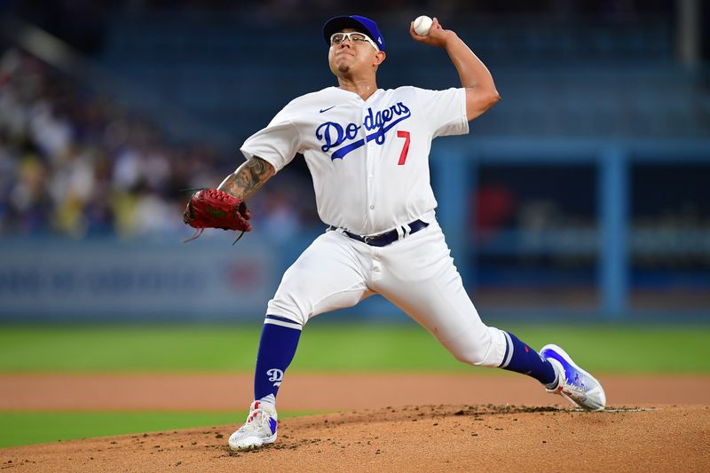 September 1, 2023; Los Angeles, California, USA; Los Angeles Dodgers starting pitcher Julio Urias (7) throws against the Atlanta Braves during the first inning at Dodger Stadium. Mandatory Credit: Gary A. Vasquez-USA TODAY Sports