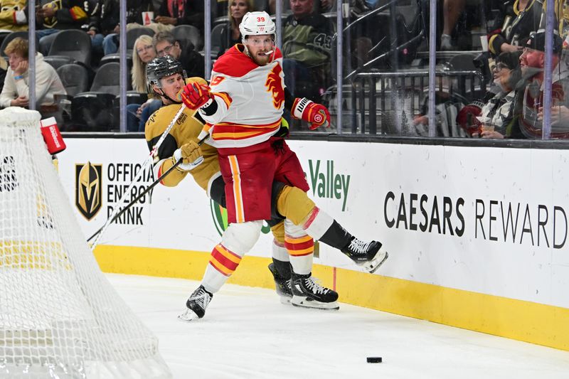 Oct 28, 2024; Las Vegas, Nevada, USA; Vegas Golden Knights defenseman Zach Whitecloud (2) collides with Calgary Flames right wing Anthony Mantha (39) in the third period of the game at T-Mobile Arena. Mandatory Credit: Candice Ward-Imagn Images